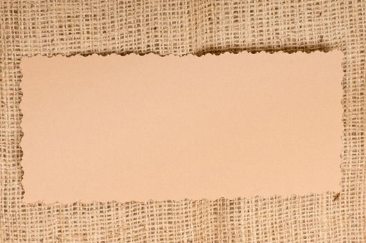 Old paper tag on natural burlap