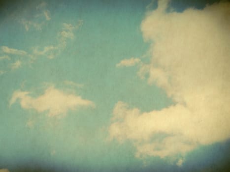 Vintage background in the blue shade with clouds