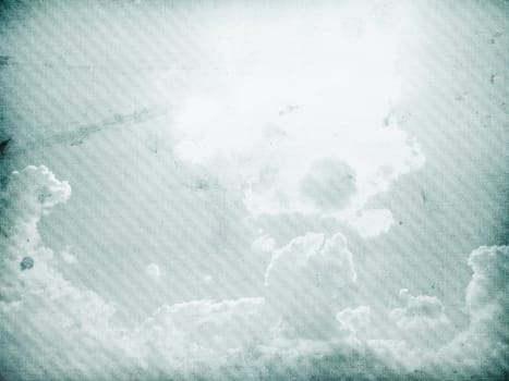 Fog and clouds on a vintage, textured paper background with a color gradient.
