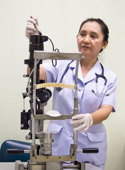 Nurse Cleaning Hospital Equipment; Optometer