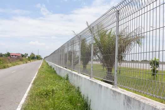 Steel fence along the road.