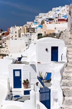 Santorini village with whitewashed houses and staircase
