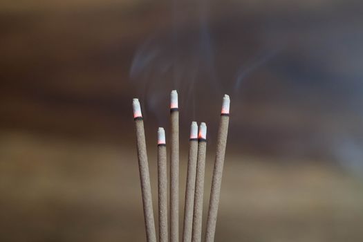incense sticks burning in an altar