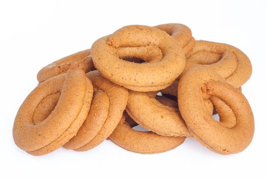 Pile of moustokouloura, Greek grape juice biscuits, on a white background.