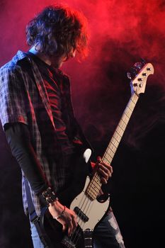 a bassist plays at a live concert