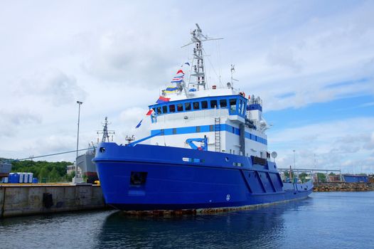 The salvage ship costs in port at a mooring