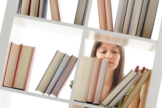 young Woman looking for a book at the library , similar photo on my portfolio