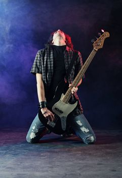 a bassist plays at a live concert