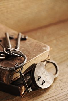 old keys on a old book, antique wood background