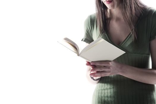 young woman, holding an open book, read against the white background 