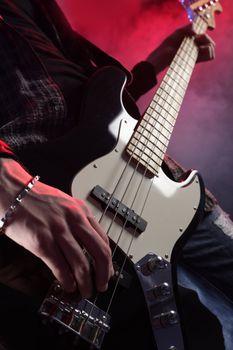 a bassist plays at a live concert