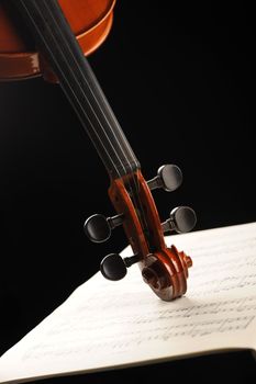 Elegant shot of a violin on a music sheet