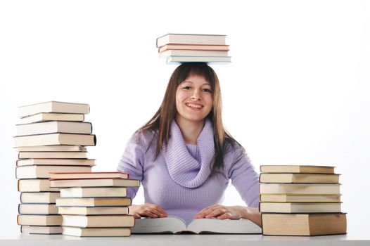 Female student with books on white background