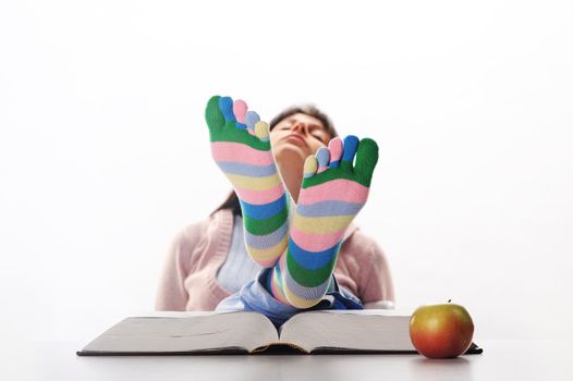 Tired of studies,  student relaxing  with his feet up on his desk, similar pictures on my portfolio