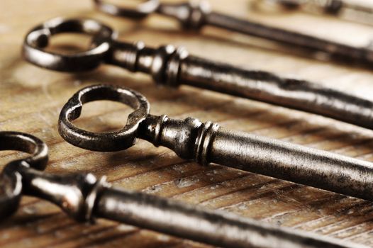 old keys on a wooden table, close-up