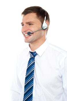 Customer support executive assisting clients wearing headset and looking away