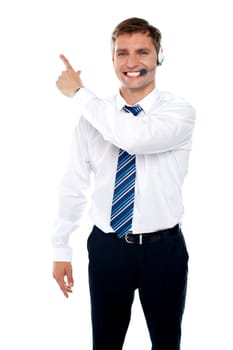 Male executive indicating towards copy space area isolated on white