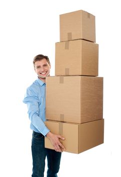Handsome male with with stack of boxes isolated on white