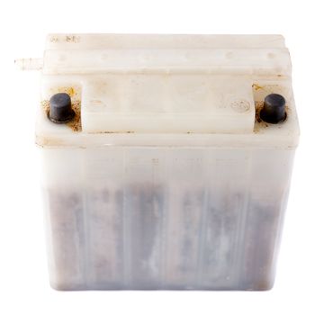 old motorcycle battery on a white background