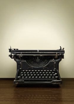 Old Vintage Typewriter on wooden Office desk