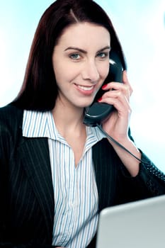 Woman communicating on phone in front of camera