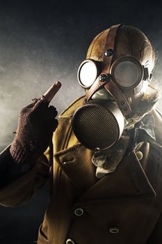 grunge portrait man in gas mask, fuck sign