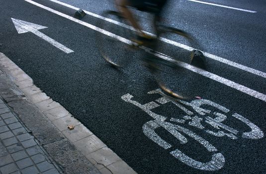 Speedy cyclist commuting on an urban cycleway.