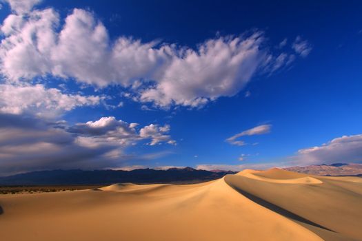 Dark blue skies over the Mesquite Flat Sand Dunes of Death Valley National Park.