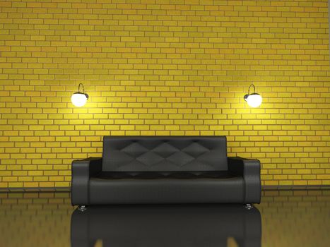 Big black sofa near a brick wall