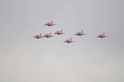 LONDON, UK, Saturday July 14, 2012. The Red Arrows from the Royal Air Force Aerobatic Team displaying at Farnborough International Airshow 2012. They fly on BAE Hawk Trainer T1A.