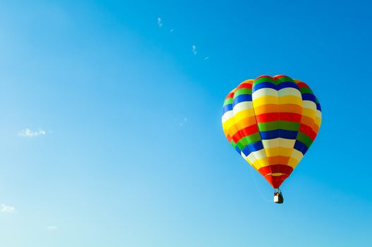 Colorful balllon in blue sky and little cloud