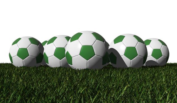 Green soccer balls on a green grass - white background