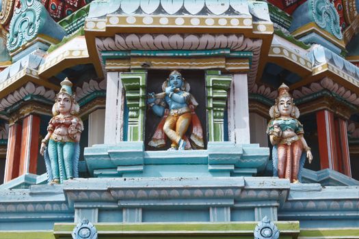 Krishna image. Sculptures on Hindu temple gopura (tower). Sri Ranganathaswamy  temple. Madurai, Tamil Nadu, India