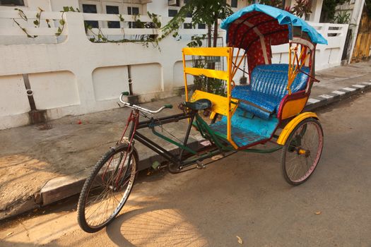 Empty bicycle rickshaw in street. Pondicherry, South India