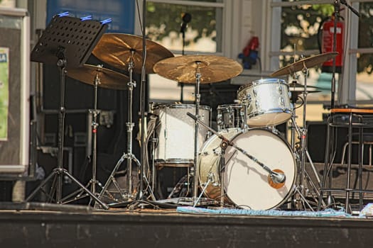 Drumset with nobody on stage, outdoors, isolated