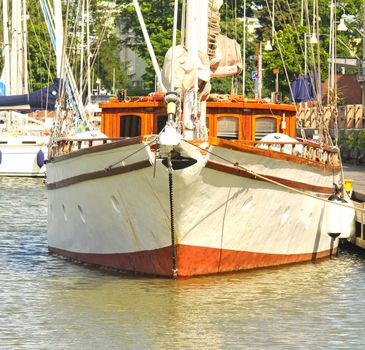 Big white sailboat laying at rest at harbor