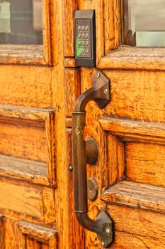 Old wooden door, with modern code opener