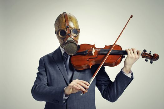 businessman with gas mask, plays the violin