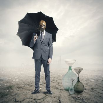 Global Warming:Businessman waiting for the rain