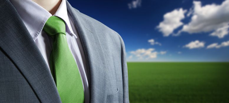 environment concept: Close up of classic business attire with green   tie and elegant blazer.