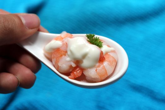 tasty fresh shrimps on a spoon