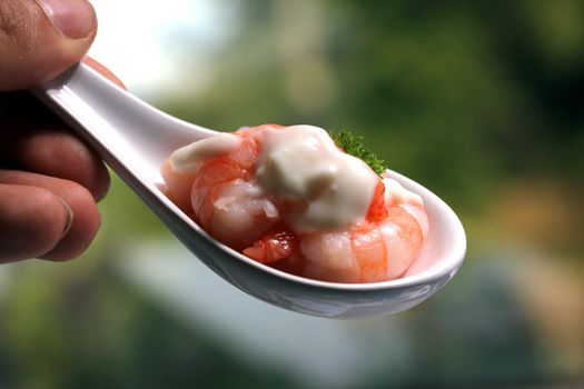 tasty fresh shrimps on a spoon