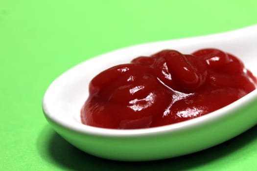 ketchup on a porcelain spoon