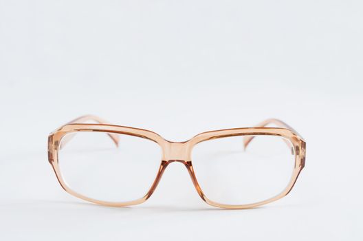 Photo of baby brown  eyeglasses  on white background
