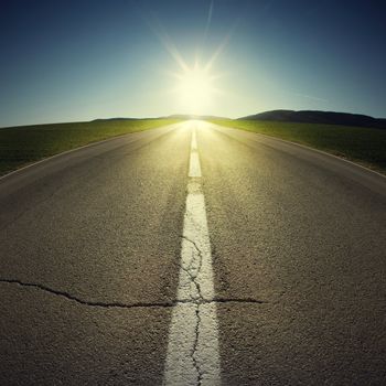 asphalt of country road in backlight