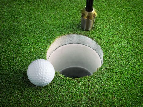 golf ball on lip of cup of lovely tropical golf course