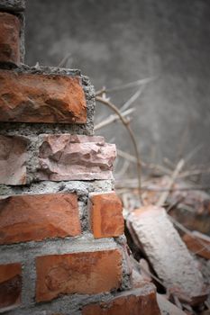 Bricks and mortar with broken walls 