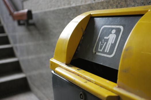 yellow garbage can close up