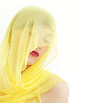 Young beautiful woman hidden by a veil 