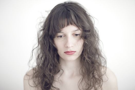 portrait photo of a sad and depressed young woman